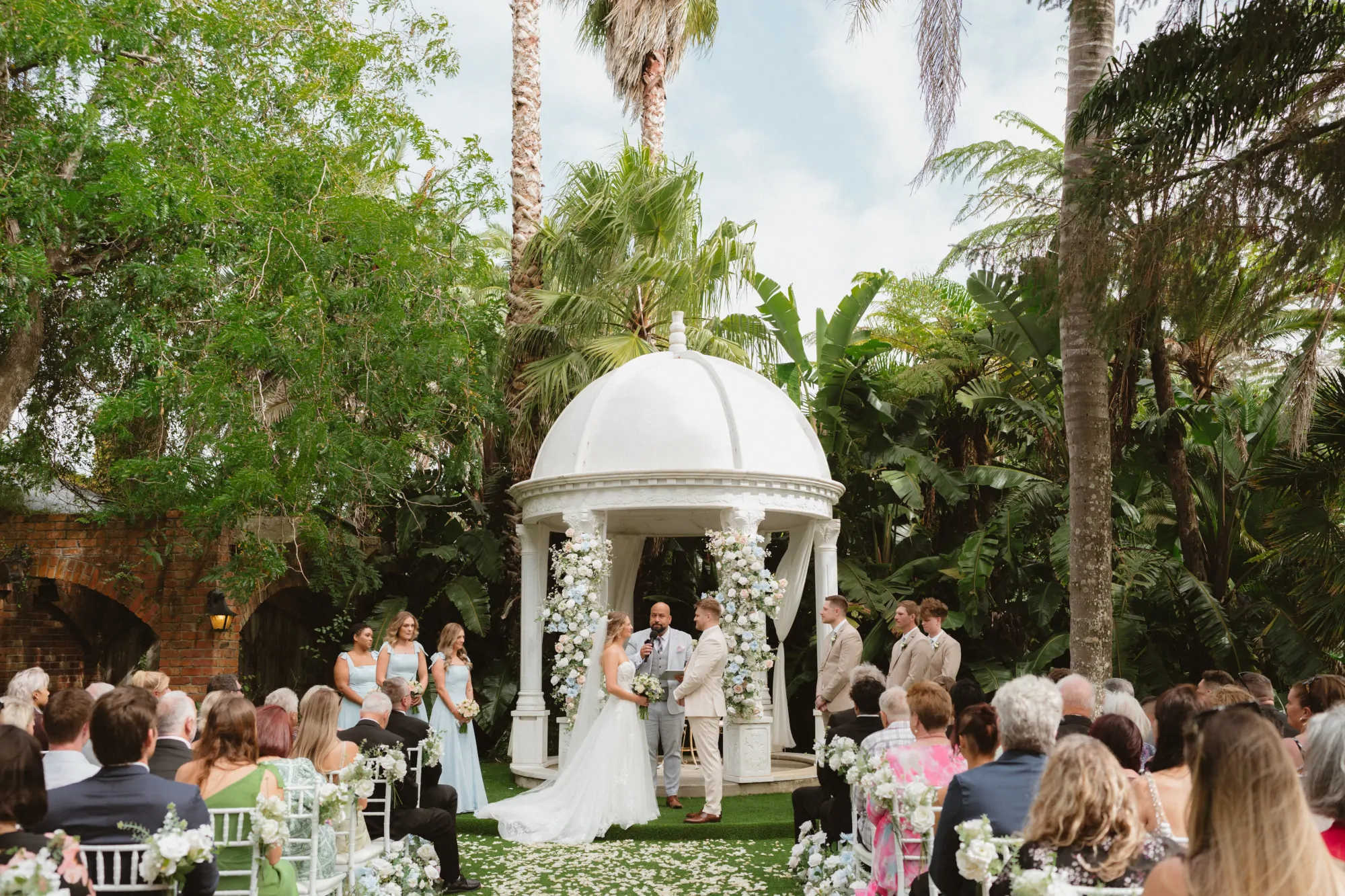 Nate Dunn officiating a wedding ceremony at Settlers Country Manor in Waimauku