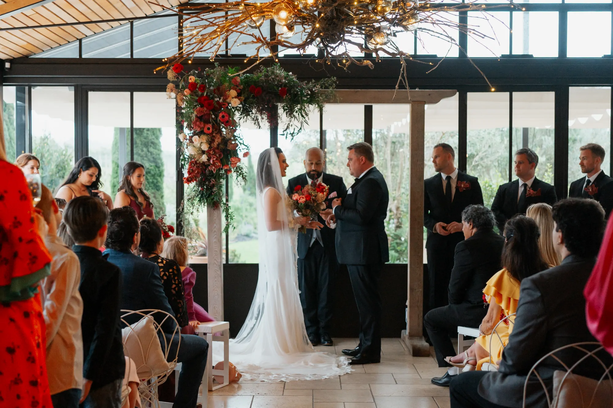 Nate Dunn officiating a wedding ceremony at Tantalus Estate in Waiheke Island