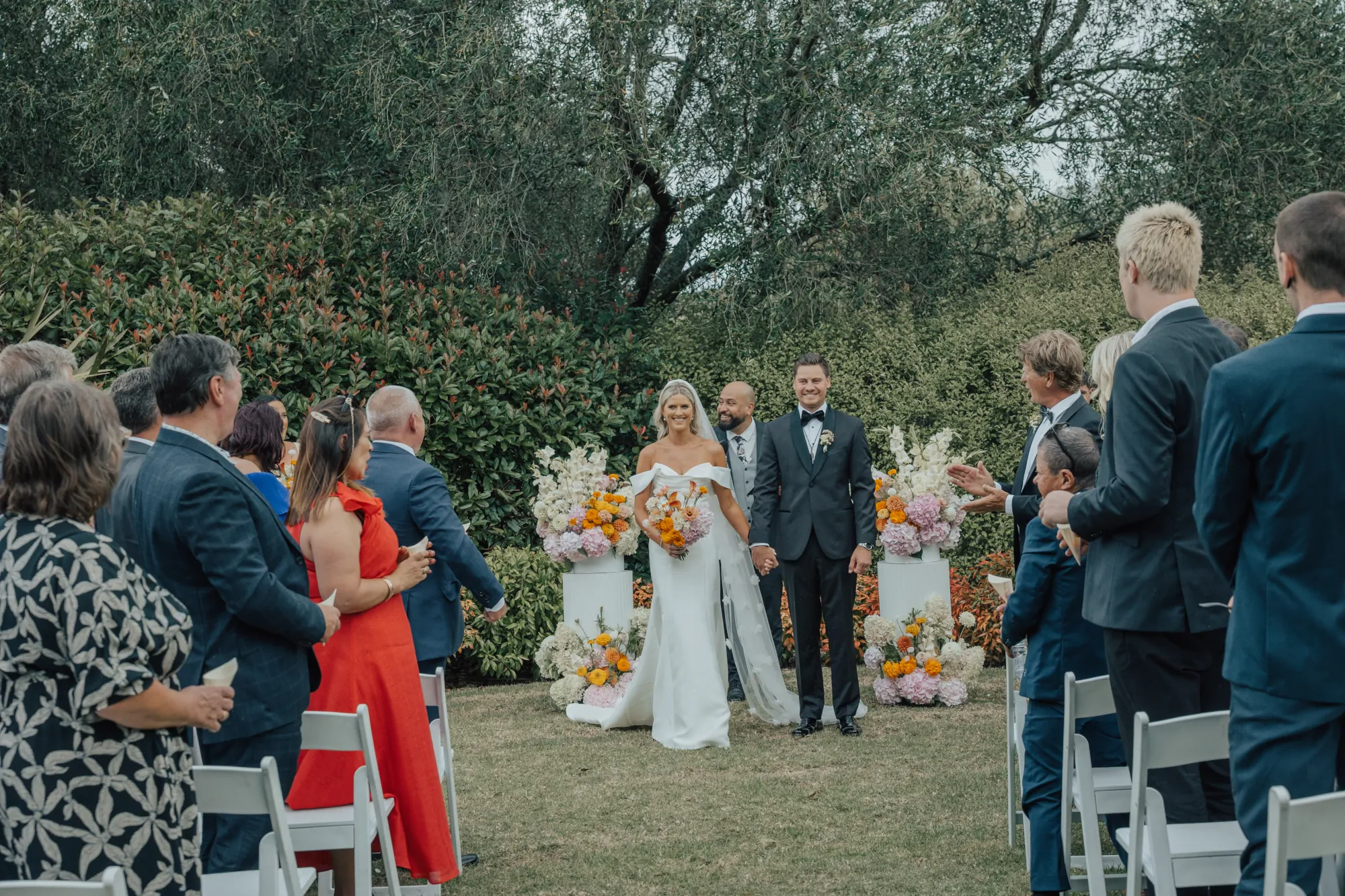 Nate Dunn officiating a wedding ceremony at The Hunting Lodge in Waimauku
