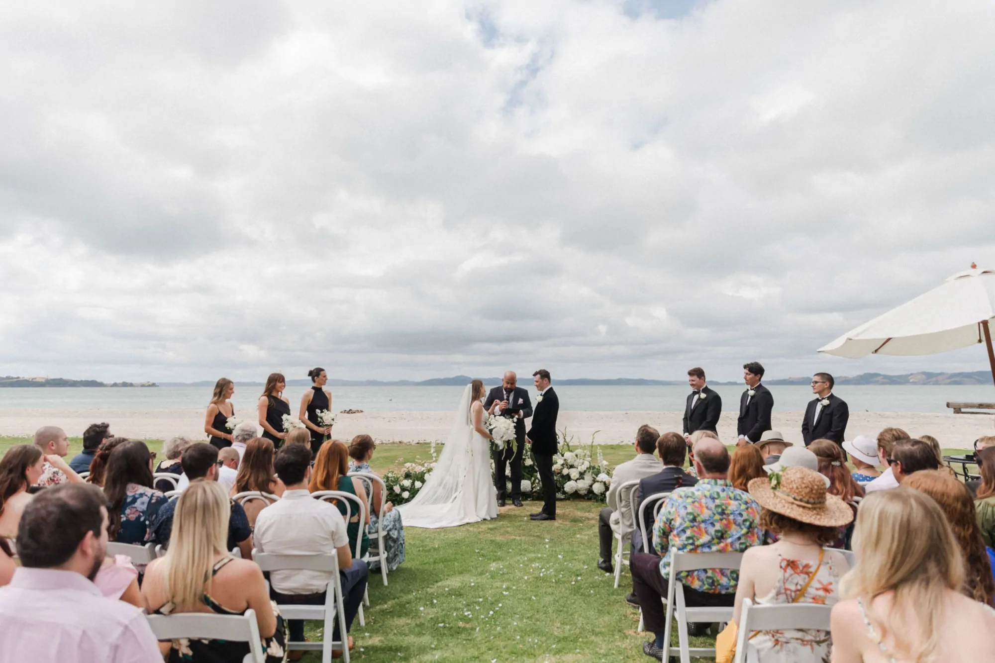 Nate Dunn officiating a wedding ceremony at The McCallum Residence in Clevedon