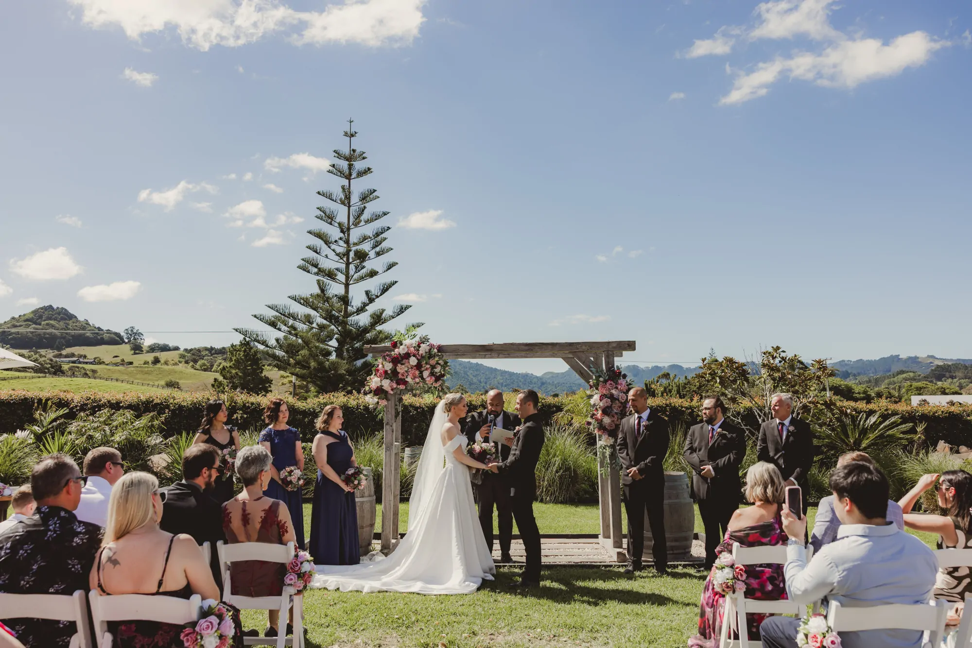 Nate Dunn officiating a wedding ceremony at The Stables Matakana in Matakana